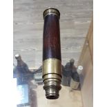 A four drawer brass and rosewood telescope inscribed 'Dolland London'.