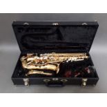 An Evette Buffet Crampon alto saxophone in case.