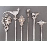 A matched set of six silver plated skewers, each with animal finials, the fish, bull, snake and