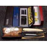 A mixed lot comprising a pair of rolled gold spectacles, two cut throat razors and assorted pens.