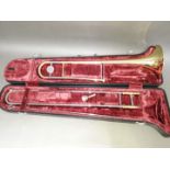 A Yamaha YSL 354 trombone with hard case.