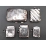 A collection of hallmarked silver vesta cases and a small cigarette case, gross wt. 3.6ozt.