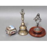 A mixed lot comprising an Indian brass temple bell, an Art Deco style match striker and a souvenir