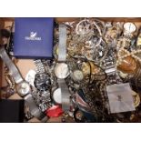 A box of assorted costume jewellery and watches.