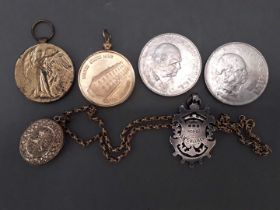 A mixed lot comprising a gold plated locket on chain, a WWI Victory medal awarded to 58807 PTE J