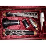 A Rudall Carte Super Graduate clarinet in hard case.