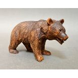 A Black Forest carved figure of a bear, length approx 14 cm.