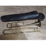 A vintage Couesnon trombone in case.