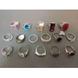 A collection of 16 silver rings, various settings, marked 925.