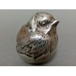A large Edwardian silver pin cushion, modelled in the form of a chick, stamped Rd 475678, Chester,