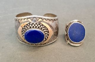 A bracelet marked 925 with blue insert, together with similar ring in white metal but unmarked