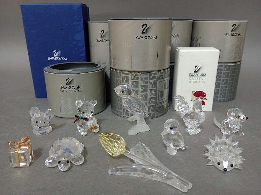 Ten Swarovski crystal ornaments, all with boxes.