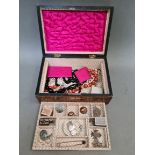 A wooden jewellery box containing various jewellery to include silver, white metal, yellow metal,