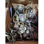 A selection of EPNS ware to include teapots, sugar bowls, milk jugs, toast rack, cruet set, clam
