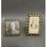 Two Edwardian brass chain frames.