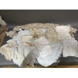 A collection of Victorian / Edwardian christening gowns and related clothing, etc.