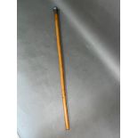 A malacca walking cane with Indian white metal top, length 83cm.