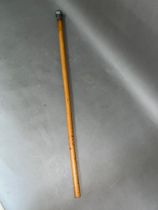 A malacca walking cane with Indian white metal top, length 83cm.