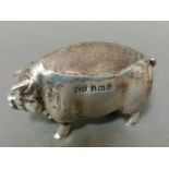 A silver novelty pin cushion in the form of a pig, 5cm long, Birmingham, Levi & Salaman, 1903.