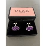 A pair of Thomas Pink cuff-links.