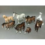 Six Beswick horses, a Beswick dog and a Russian otter.