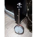 An Ozark 5 string banjo with soft case.