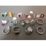 A collection of 15 silver rings, various settings, marked 925.