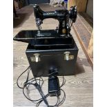A Singer 222K Featherweight electric sewing machine, circa 1954, with box, power lead and pedal.