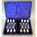 A hallmarked silver cased set of 12 teaspoons and sugar snips, Thomas Latham & Ernest Morton,