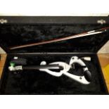 A cased silver coloured electric violin with bow.