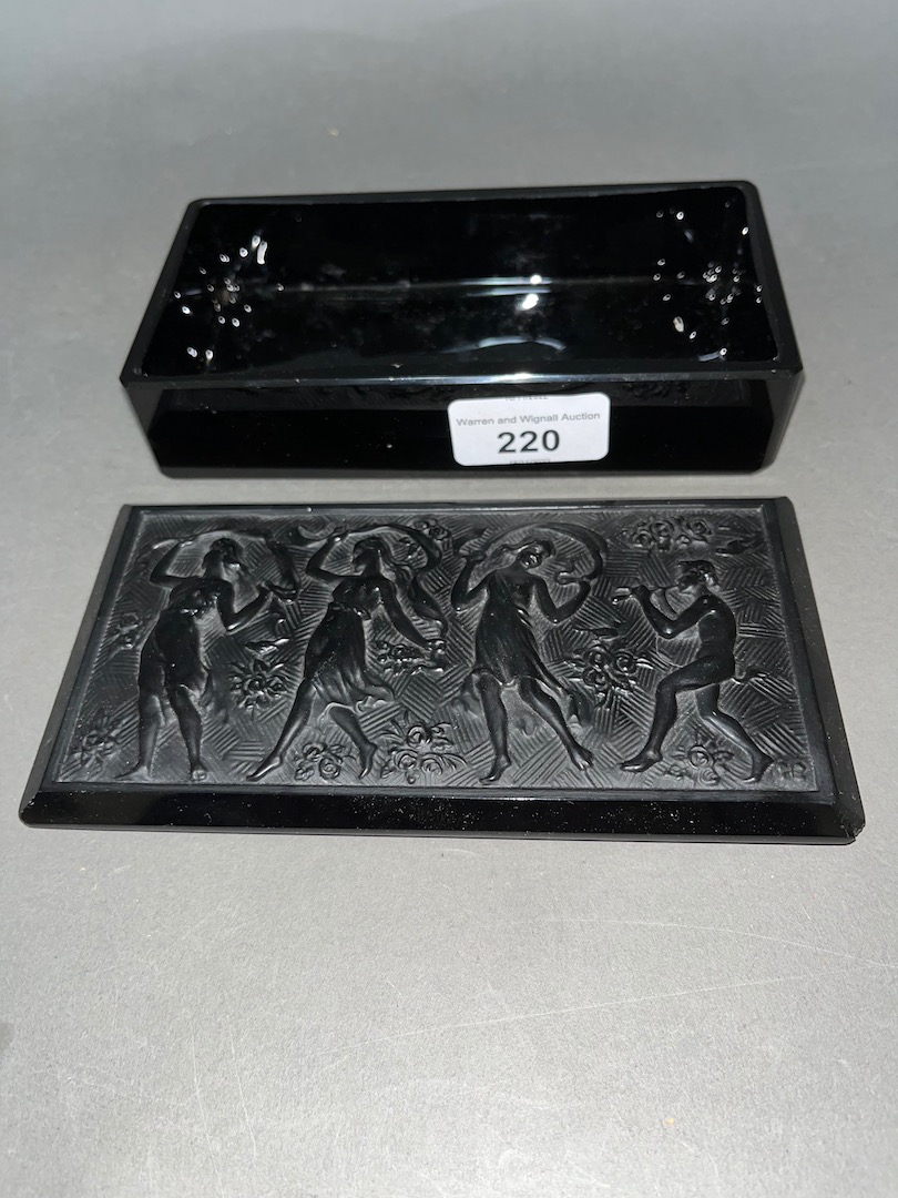 A Baccarat black glass casket depicting dancing maidens.