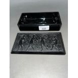 A Baccarat black glass casket depicting dancing maidens.