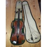 A Stradivarius copy student violin, two piece back, length 340mm, with bow and case, together with a