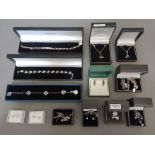 A collection of mainly silver jewellery to include sets, bracelets, identity bracelet, pendants,