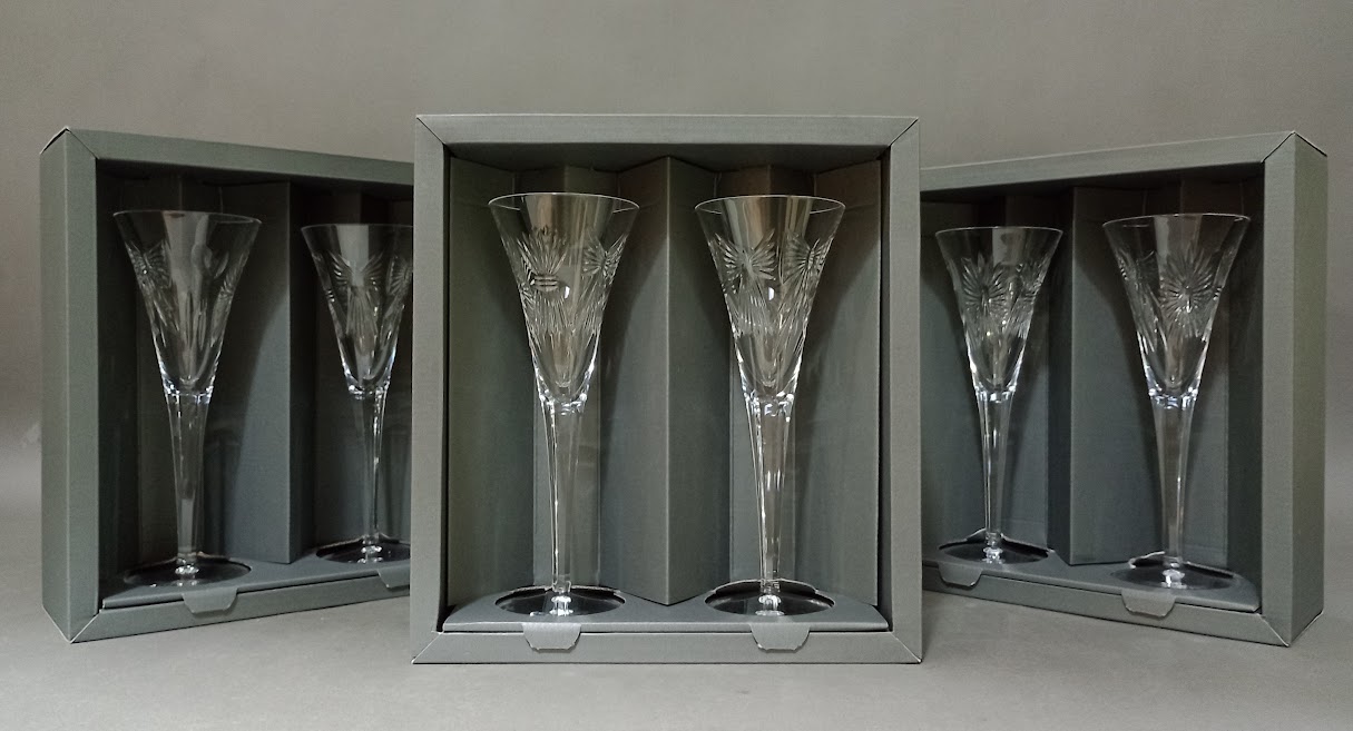 3 boxed sets of Waterford Crystal Millennium Collection toasting flutes.