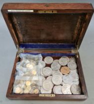 A wooden box containing commemorative crowns etc. and 2 bags of Borough of Darlington travel tokens