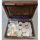 A wooden box containing commemorative crowns etc. and 2 bags of Borough of Darlington travel tokens