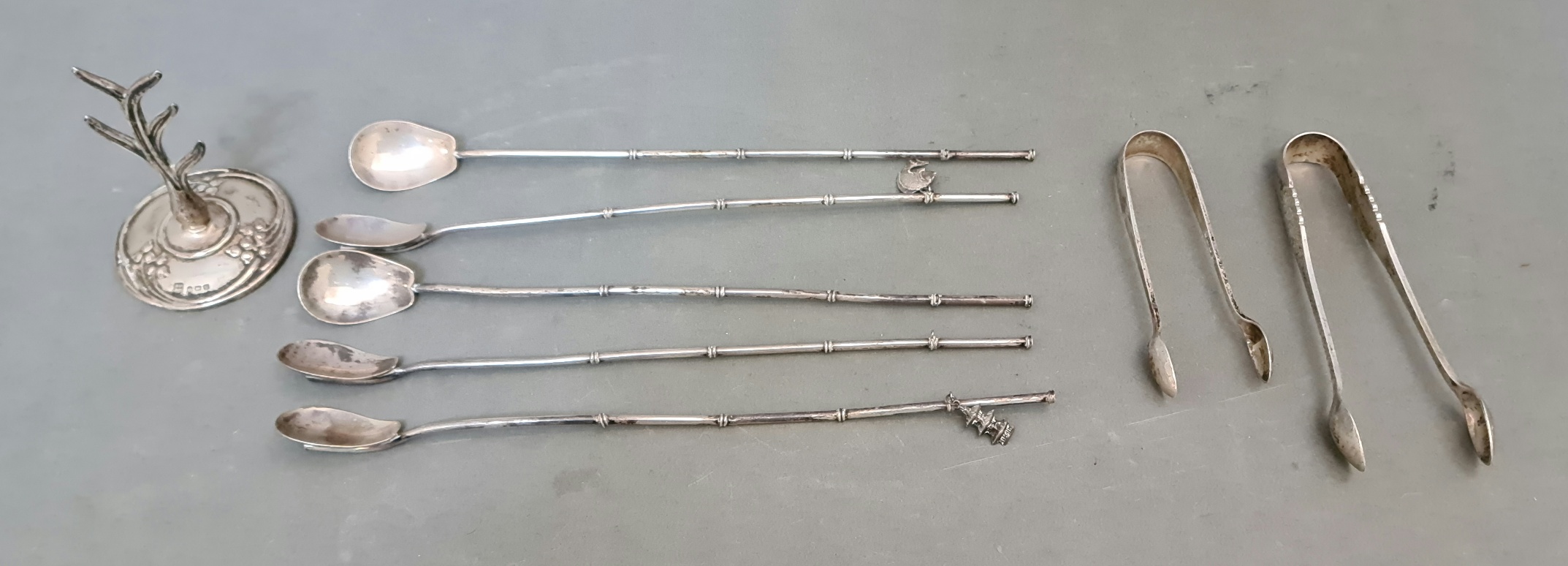 A selection of silver items including 5 Japanese "bamboo" cocktail / tea spoons, two pairs of