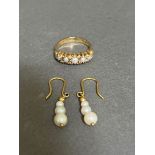 A 9ct gold pearl ring together with a pair of 9ct gold 3 pearl drop earrings.