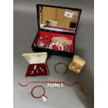 A jewellery box containing various jewellery pieces including silver, etc.