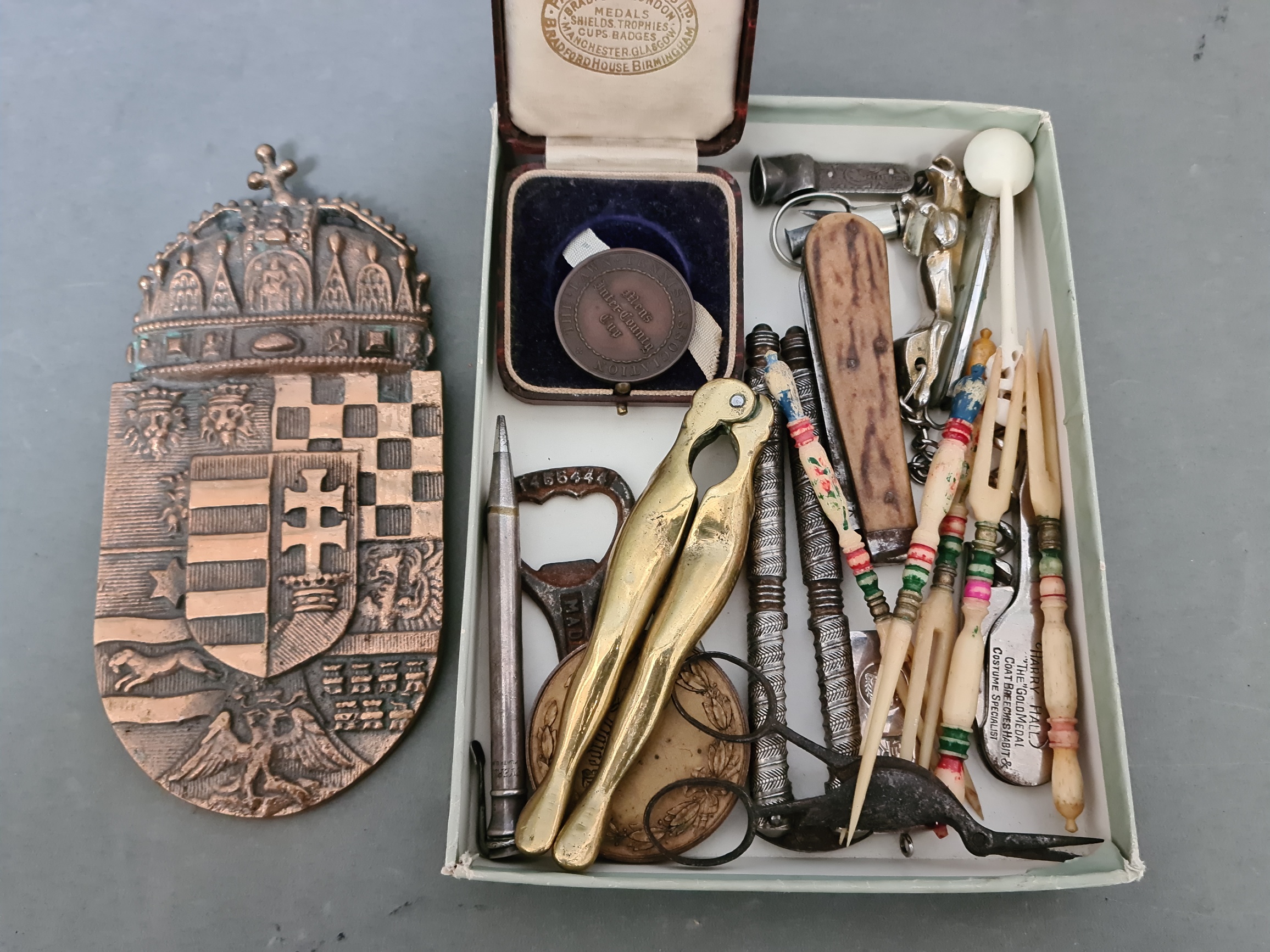 A small box of bric a brac including sports medals, penknives, propelling pencil etc