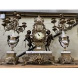A brass and marble Imperial Brevattato mantel clock with candelabra garniture, height 25inches.