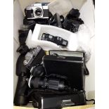 A box of camera bodies, lenses, movie cameras etc.
