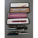 A collection of pens, etc to include a Parker with 14ct gold nib, a rolled gold pen, etc.