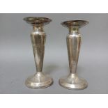 A pair of hallmarked silver vases/candlesticks, Chester, possibly J & R Griffin (Joseph & Richard