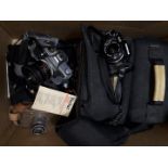 A box of assorted camera items including an Olympus OM40, a Canon TX etc.