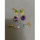 Three pairs of 9ct gold earrings to include amethyst, jade and topaz.