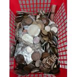 A basket of GB and world coins, with some white metal items.