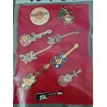 A collection of Hard Rock Cafe badges; Edinburgh, New York, Manchester, San Francisco (limited