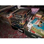 A collection of board games including Scrabble, Battleship, Mad Marbles, Scream Inn, Cluedo,